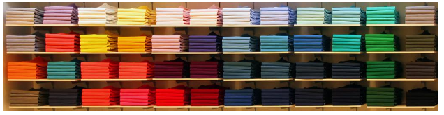 Stacks of t-shirts on shelves