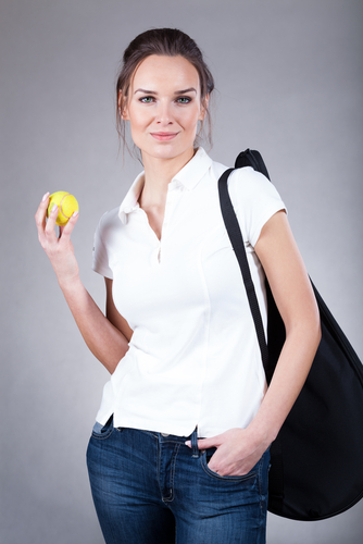 Female tennis player wearing polo shirt