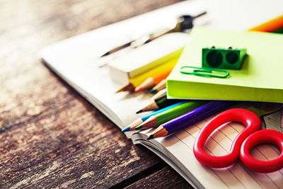 school supplies wooden background