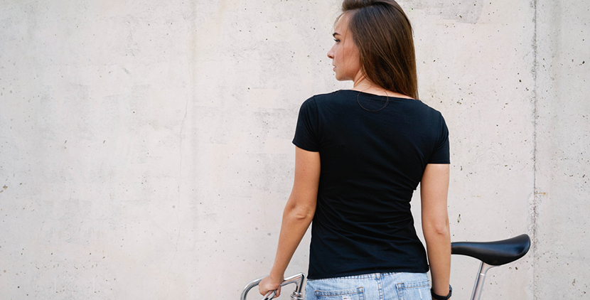 woman wearing black t shirt bike