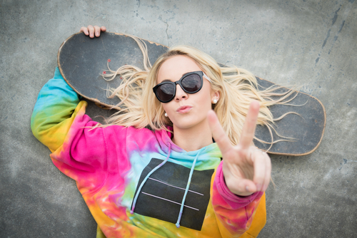 blonde skater giving peace sign