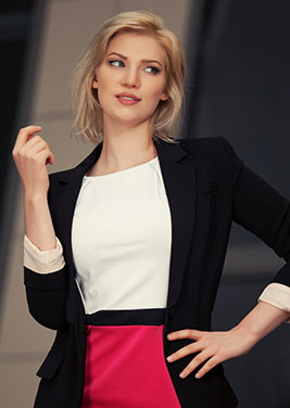 stylishly dressed woman wearing white shirt and blazer