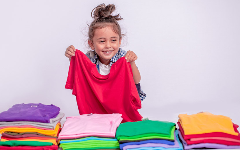 girl folding her t shirts