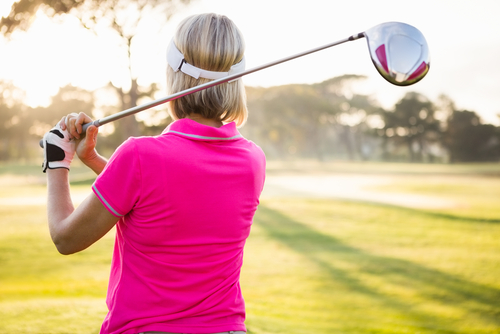 woman golfer in polo