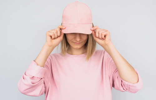 young female wearing pink sweater