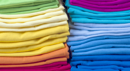 pile of bright folded t shirts