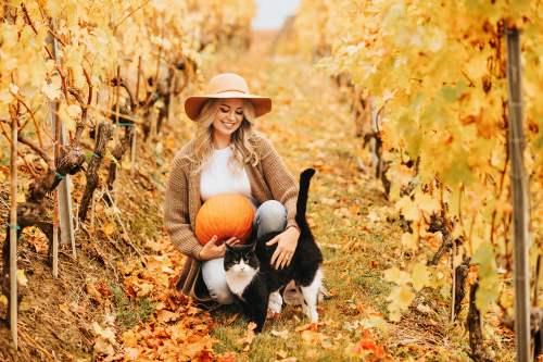 autumn themed portrait of woman with cat