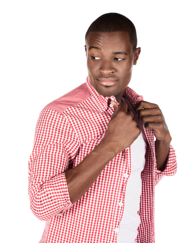 man buttoning up collared shirt