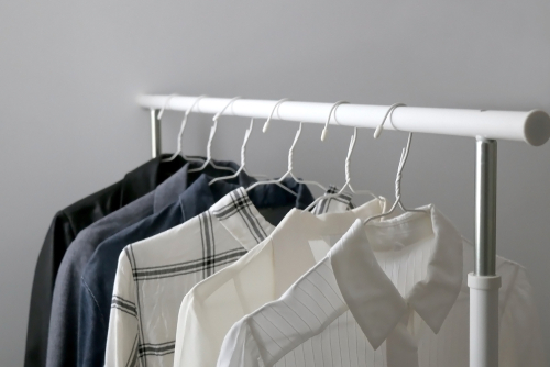 capsule wardrobe clothes on rack