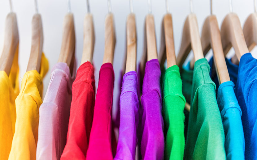 variety colorful shirts on hangers