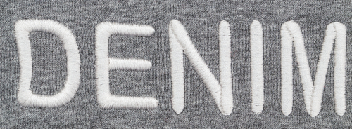 denim wording embroidered into gray