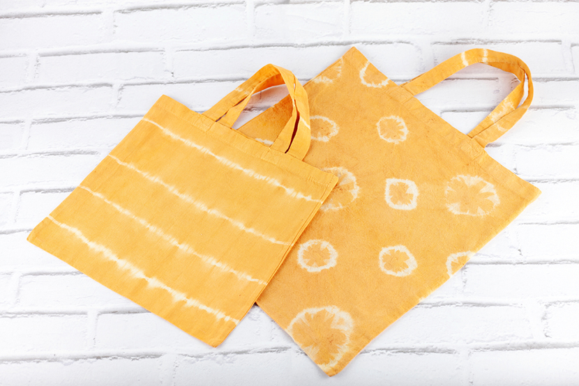 Natural fabric dyes. Cotton bags with handmade decorations. Dyeing with plants