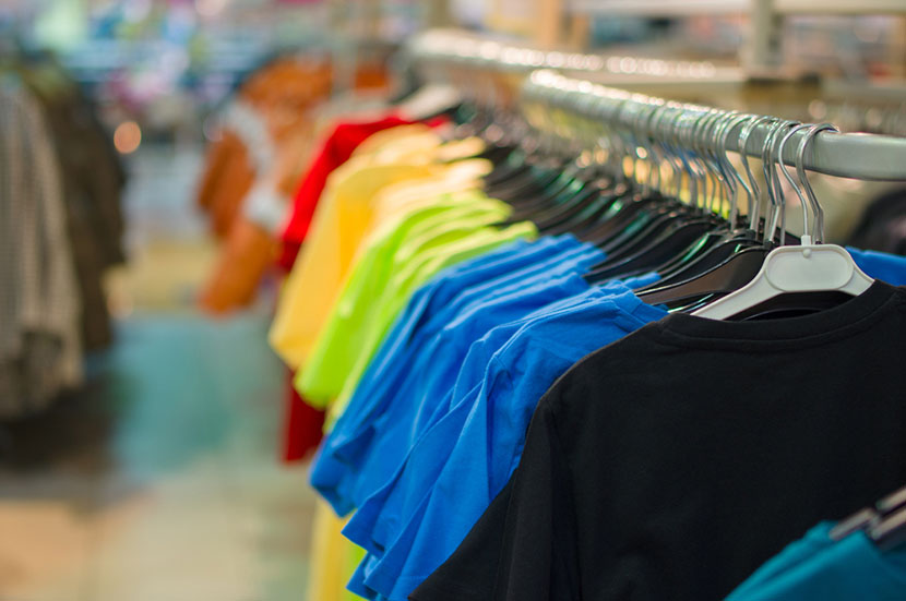 Bright color t-shirts on stands